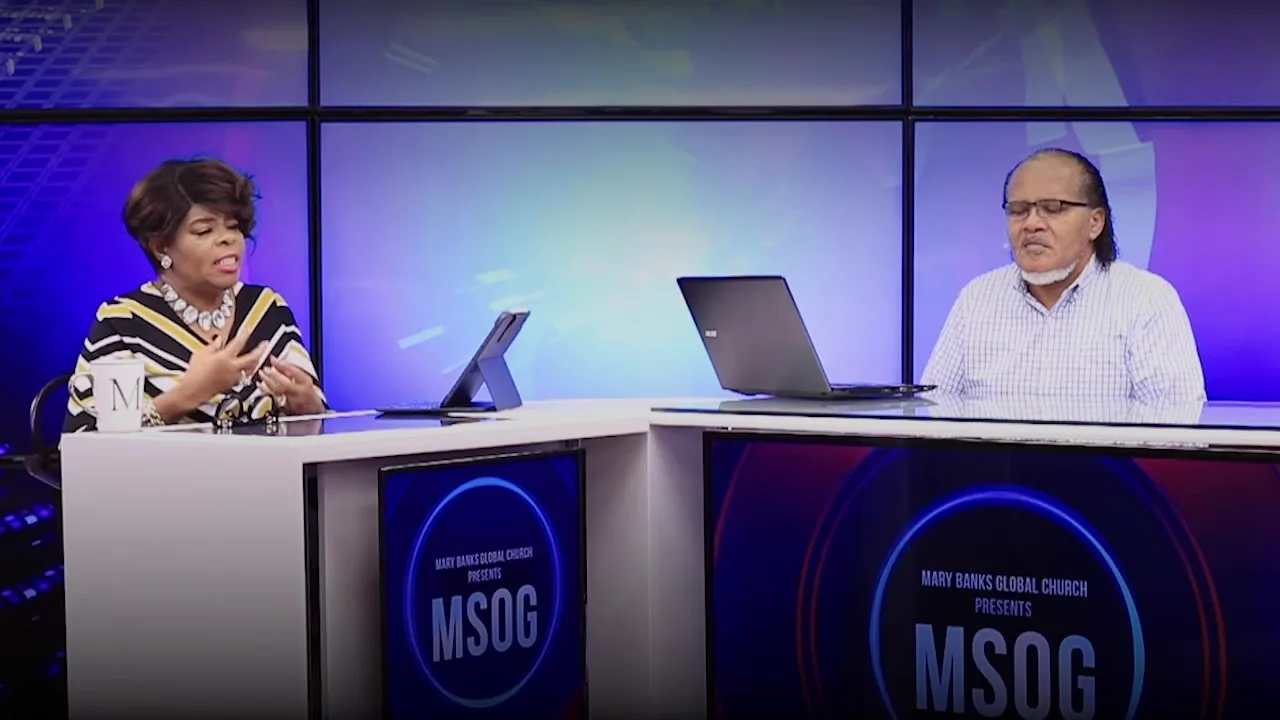 Two hosts at the ministry's broadcast studio desk
